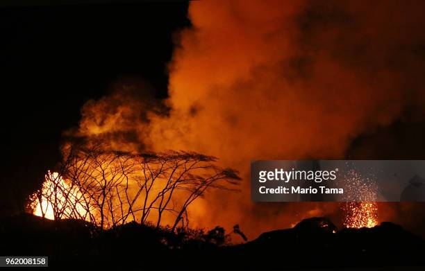 Lava erupts from a Kilauea volcano fissure in Leilani Estates, on Hawaii's Big Island, on May 23, 2018 in Pahoa, Hawaii. Officials are concerned that...