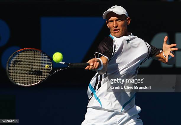 Nikolay Davydenko of Russia plays a forehand in his quarterfinal match against Roger Federer of Switzerland during day ten of the 2010 Australian...