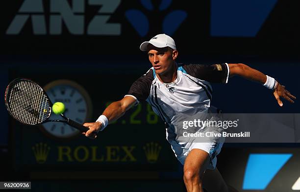 Nikolay Davydenko of Russia plays a forehand in his quarterfinal match against Roger Federer of Switzerland during day ten of the 2010 Australian...