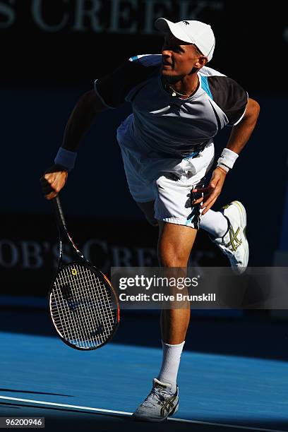 Nikolay Davydenko of Russia serves in his quarterfinal match against Roger Federer of Switzerland during day ten of the 2010 Australian Open at...