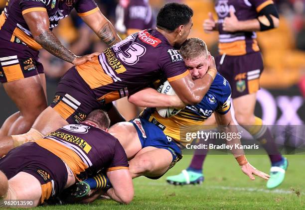 Daniel Alvaro of the Eels is tackled during the round 12 NRL match between the Brisbane Broncos and the Parramatta Eels at Suncorp Stadium on May 24,...