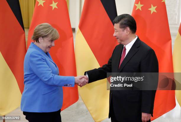 China's President Xi Jinping meets German Chancellor Angela Merkel at the Great Hall of the People in Beijing, China, May 24, 2018.