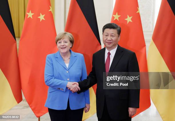 China's President Xi Jinping meets German Chancellor Angela Merkel at the Great Hall of the People in Beijing, China, May 24, 2018.