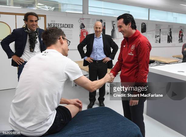 Head Coach Unai Emery meets injured Arsenal cefender Laurent Koscielny at London Colney on May 24, 2018 in St Albans, England.