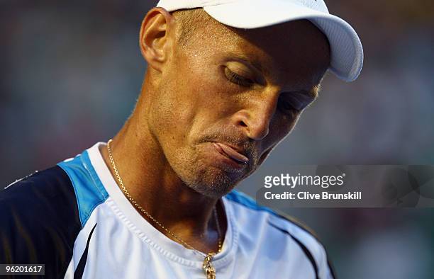 Nikolay Davydenko of Russia looks on in his quarterfinal match against Roger Federer of Switzerland during day ten of the 2010 Australian Open at...