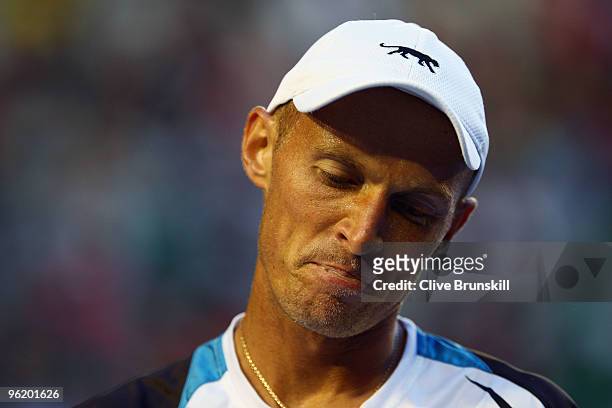 Nikolay Davydenko of Russia looks on in his quarterfinal match against Roger Federer of Switzerland during day ten of the 2010 Australian Open at...