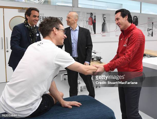 Head Coach Unai Emery meets injured Arsenal cefender Laurent Koscielny at London Colney on May 24, 2018 in St Albans, England.