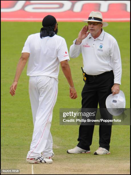 England bowler Monty Panesar and umpire Daryl Harper exchange opinions during the 1st Test match between England and South Africa at Lord's Cricket...