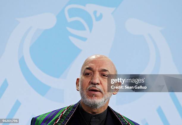 Afghan President Hamid Karzai speaks to the media after talks with German Chancellor Angela Merkel at the Chancellery on January 27, 2010 in Berlin,...