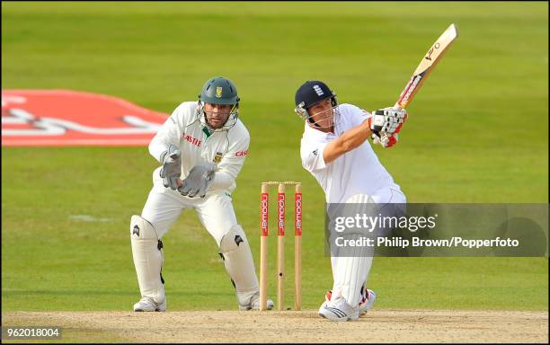 Darren Pattinson of England hits a boundary watched by Mark Boucher of South Africa during the 2nd Test match between England and South Africa at...
