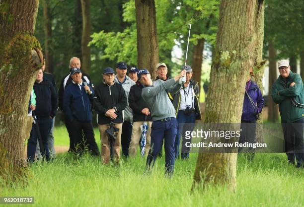 David Horsey of England plays his second shot on the 16th hole from the tree during day one of the BMW PGA Championship at Wentworth on May 24, 2018...