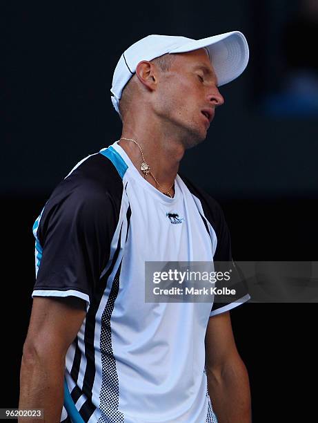 Nikolay Davydenko of Russia reacts after a point in his quarterfinal match against Roger Federer of Switzerland during day ten of the 2010 Australian...