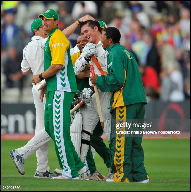 South Africa's captain Graeme Smith is congratulated by teammates after seeing his team to victory in the the 3rd Test match between England and...