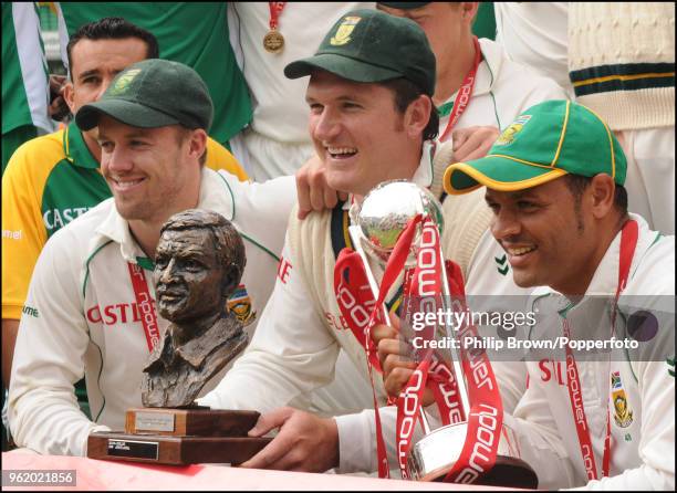 South Africa's captain Graeme Smith holds the Basil D'Oliveira series trophy and Ashwell Prince the npower trophy as South Africa celebrate winning...