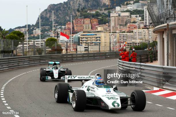 Keke Rosberg of Sweden driving the 1982 Williams FW08 and son Nico Rosberg of Germany driving the 2016 Mercedes F1 W07 on track after practice for...