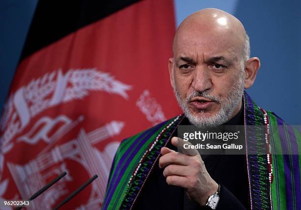Afghan President Hamid Karzai speaks to the media after talks with German Chancellor Angela Merkel at the Chancellery on January 27, 2010 in Berlin,...