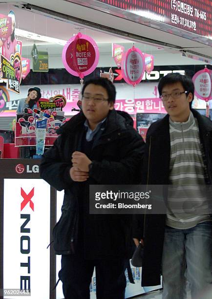 Shoppers walk past an LG Electronics Inc.'s shop in Seoul, South Korea, on Wednesday, Jan. 27, 2010. LG Electronics Inc., the world's second-largest...