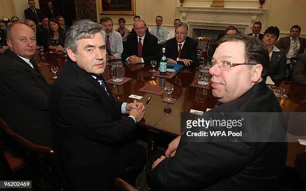 Britain's Prime Minister Gordon Brown sits beside his Irish counterpart Brian Cowen at a plenary session with the British and Irish governments at...