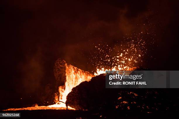 Lava lake forms in the Leilani Estates subdivision, situated in Kilauea's East Rift Zone in Hawaii on May 23, 2018 amid eruptions from the Kilauea...