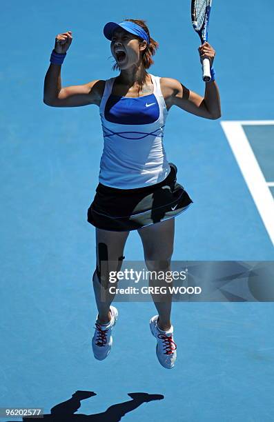 Li Na of China jumps for joy after winning match point against Venus Williams of the US in their women's singles quarter-final match on day 10 of the...