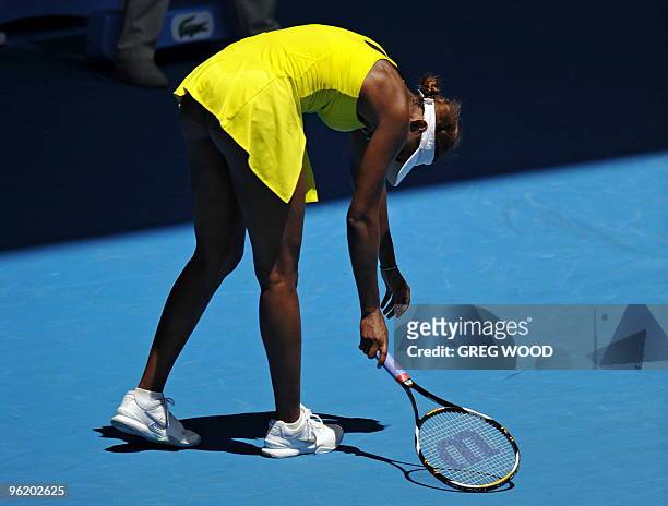 Venus Williams of the US reacts during her loss to Li Na of China in their women's singles quarter-final match on day 10 of the Australian Open...