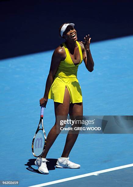 Venus Williams of the US reacts during her loss to Li Na of China in their women's singles quarter-final match on day 10 of the Australian Open...