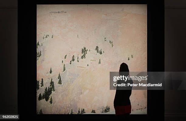 An employee views Peter Doig's 'Saint Anton' on display at Sotheby's on January 27, 2010 in London, England. Executed between 1995 and 1996 this work...