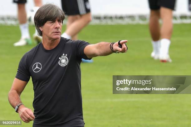 Joachim Loew, head coach of Germany gives intsructions to his players during a training session of the German national team at Sportanlage Rungg on...