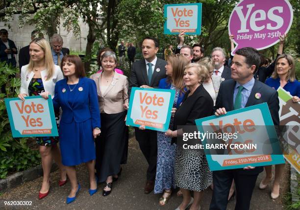 Ireland's Prime Minister Leo Varadkar poses with activists from the "Yes" campaign, urging people to vote 'yes' in the referendum to repeal the...