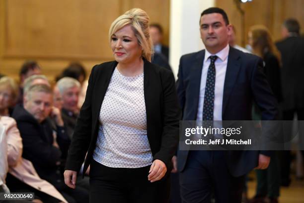Sinn Fein politician Michelle O'Neill listens to Labour leader Jeremy Corbyn, delivering a speech at Queens University on May 24, 2018 in Belfast,...