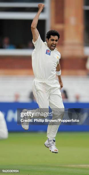 Umar Gul of Pakistan celebrates after dismissing Australia's Michael Hussey for a first-ball duck during the 1st Test match between Australia and...