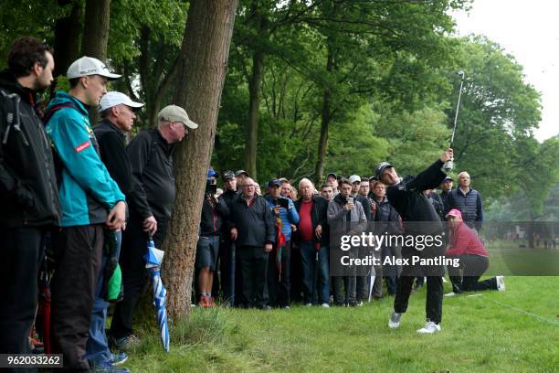 Paul Dunne of Ireland plays his second shot on the 16th during day one of the 2018 BMW PGA Championship at Wentworth on May 24, 2018 in Virginia...