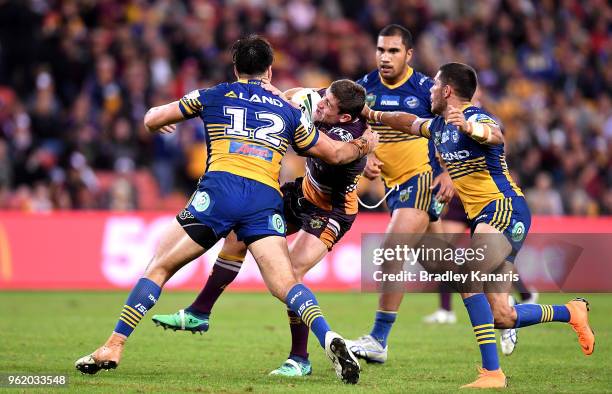 Andrew McCullough of the Broncos takes on the defence during the round 12 NRL match between the Brisbane Broncos and the Parramatta Eels at Suncorp...