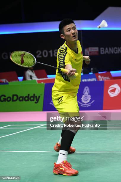 Chen Long of China competes against Chou Tien Chen of Chinese Taipei during the Quarter-finals match on day five of the BWF Thomas & Uber Cup at...