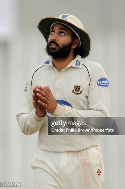 Monty Panesar of Sussex looks up while in the field during the LV County Championship match between MIddlesex and Sussex at Uxbridge, London, 24th...