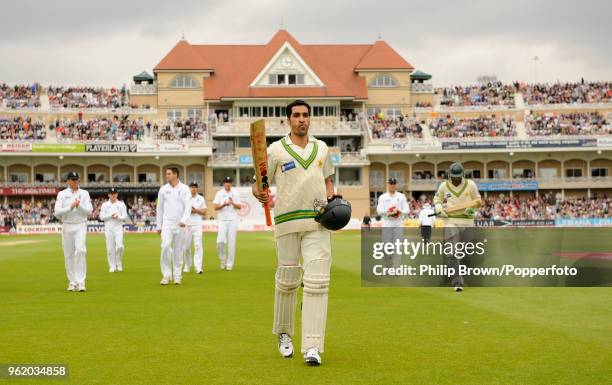 Umar Gul of Pakistan leaves the field at the end of Pakistan's 1st innings on 65 not out during the 1st Test match between England and Pakistan at...