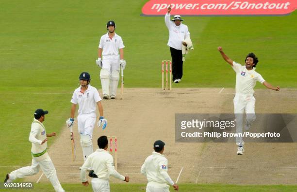 Mohammad Asif of Pakistan celebrates after dismissing England batsman Alastair Cook for 12 runs during the 1st Test match between England and...