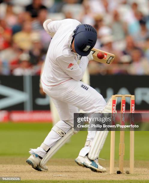 Graeme Swann of England is hit on the helmet by a delivery from Pakistan's Umar Gul during the 1st Test match between England and Pakistan at Trent...