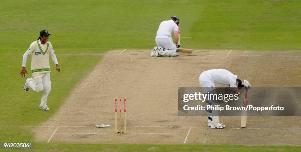 England batsman Eoin Morgan picks himself up after being run out for 17 runs by Umar Akmal of Pakistan during the 1st Test match between England and...