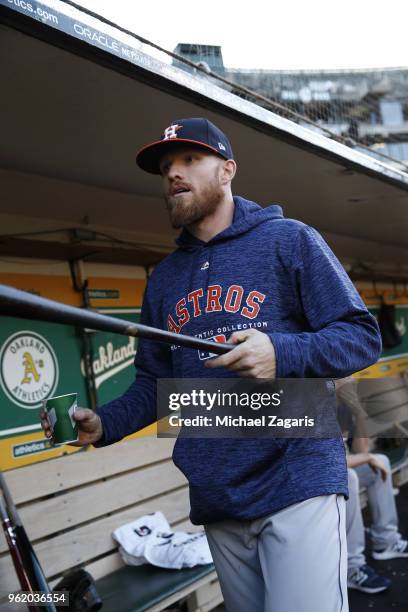 Derek Fisher of the Houston Astros stands in the dugout prior to the game against the Oakland Athletics at the Oakland Alameda Coliseum on May 7,...