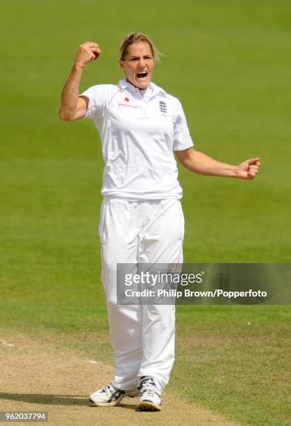 Katherine Brunt of England takes the catch off her own bowling to dismiss Australia's Alex Blackwell for 68 runs in the Only Test match between...