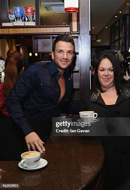 Peter Andre promotes Costa Flat White coffee with a customer at a Costa coffee shop in Piccadilly on January 27, 2010 in London, England.