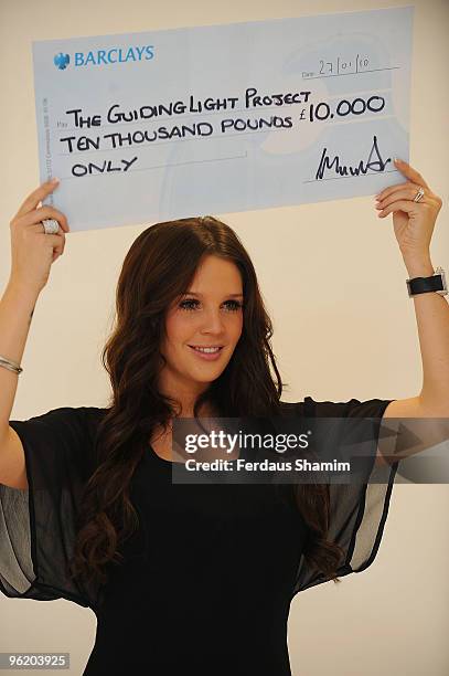 Danielle Lloyd attends a photocall to present her £10,000.00 winnings from tv show 'Celebrity Total Wipe Out' to the charity Guiding Light/Lantern...