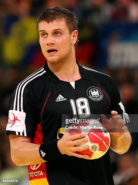 Michael Kraus of Germany plays the ball during the Men's Handball European main round Group II match between Germany and Spain at the Olympia Hall on...