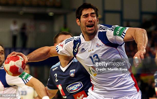Nikola Karabatic of France plays the ball during the Men's Handball European main round Group II match between Slovenia and France at the Olympia...