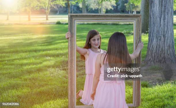 twins with frame - twins different stock pictures, royalty-free photos & images