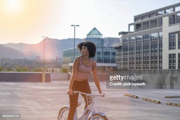 woman riding a bike - utah skyline stock pictures, royalty-free photos & images