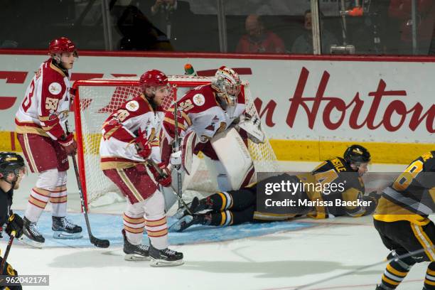 MacKenzie Entwistle of Hamilton Bulldogs dives to the ice in front of Evan Fitzpatrick of Acadie-Bathurst Titan during second period at Brandt Centre...