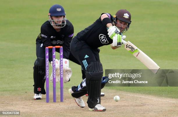 Dean Elgar of Surrey bats as Wicketkeeper Gareth Roderick of Gloucestershire looks on during the Royal London One-Day Cup match between Surrey and...