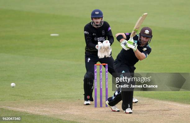 Dean Elgar of Surrey bats as Wicketkeeper Gareth Roderick of Gloucestershire looks on during the Royal London One-Day Cup match between Surrey and...
